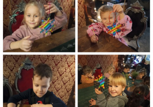 Dzieci z grupy II pokazują wykonane ozdoby choinkowe