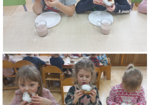 Przedszkolaki siedzą przy stole i jedzą pączki